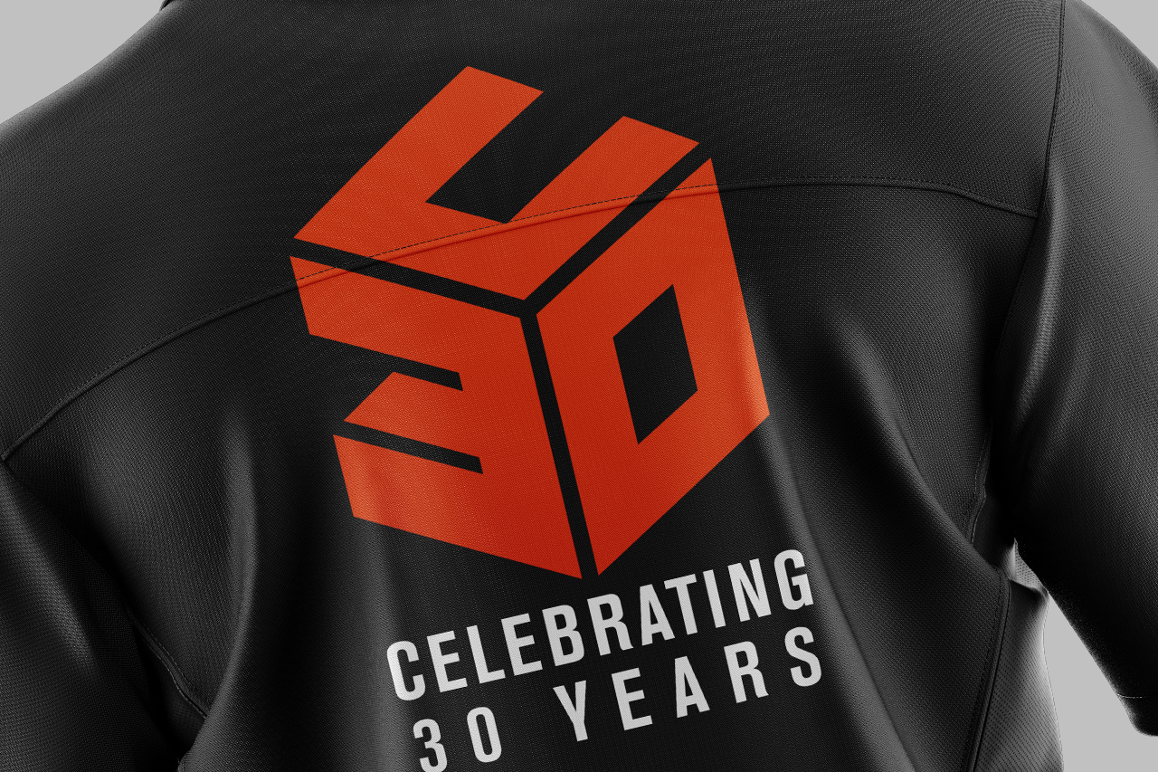 Umberslade fit out 30 years brand logo, orange logo, black polo shirt